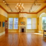 Basement remodeling in Shoreline featuring a modern finished living space with lighting, seating, and upgraded flooring