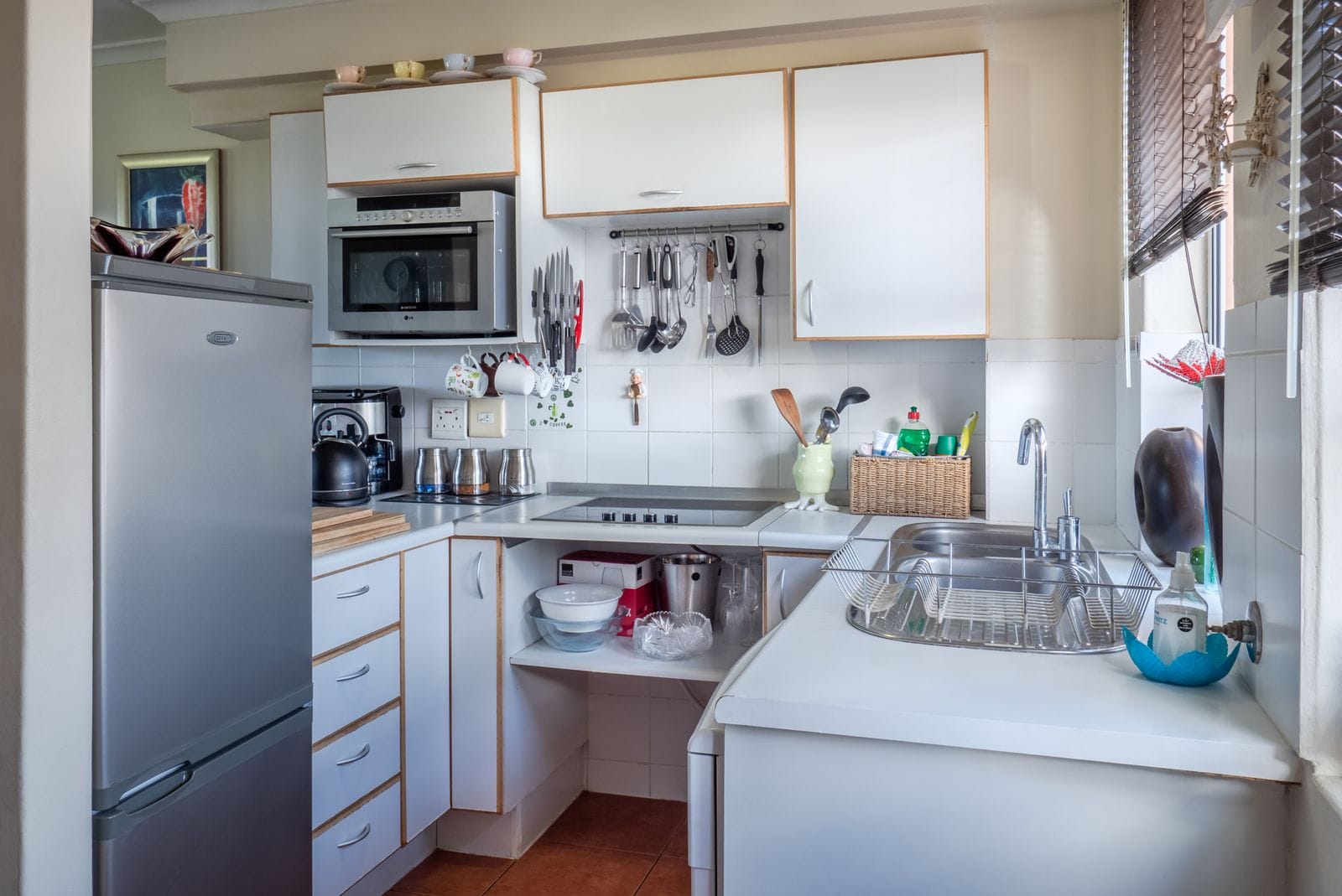 Contractor installing kitchen cabinets and countertops during kitchen remodeling in Renton WA